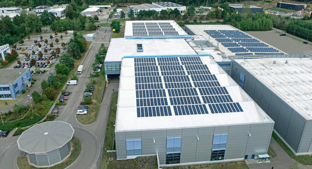 Aerial view of production hall and company buildings