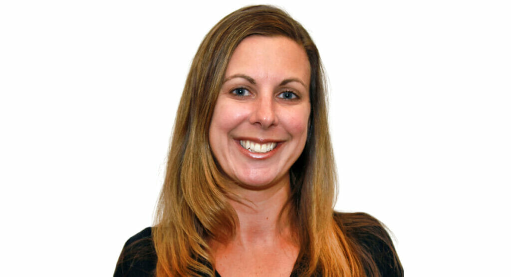 Bild von einer Frau, die in die Kamera lacht