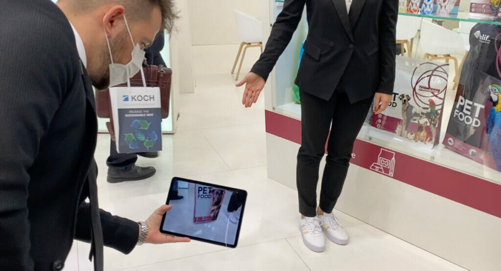 Picture of tow men, one holding a tablet