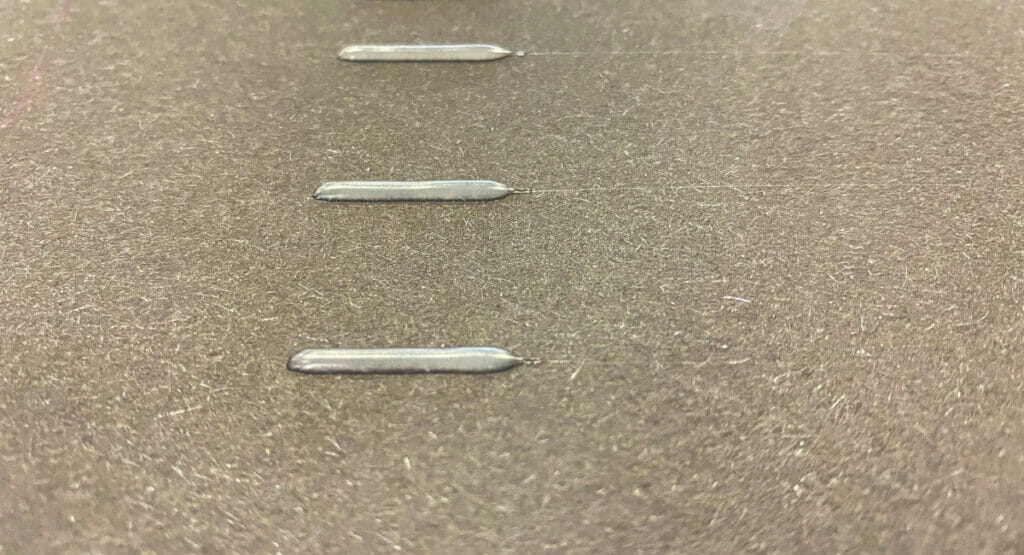 Bead application with visible thread tension